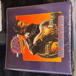 Vintage Elvis Presley collector cards in binder